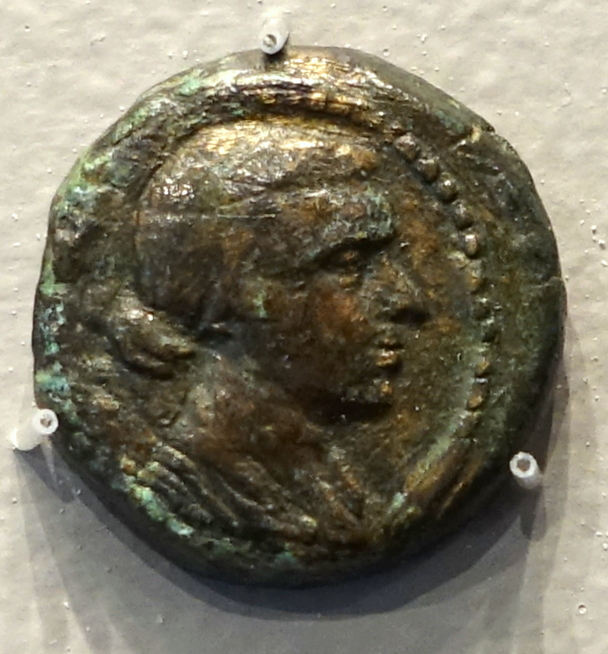 Bronze coin bearing a profile portrait of Cleopatra VII
